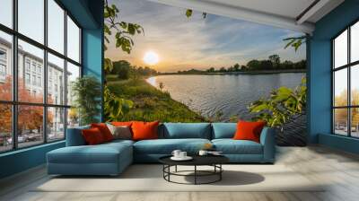 beautiful werdersee, a river in bremen surrounded by green at sunset Wall mural