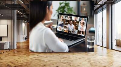 businesswoman having video conference call with colleagues. remote workers discussing work plans by video digital conference call on laptop. Wall mural