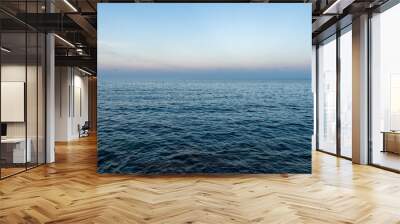 The blue mediterranean sea and a colorful horizon at Cala Ratjada on Majorca Island, Spain Wall mural