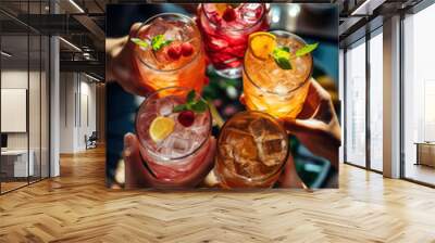 Top-View Shot of friends toasting colorful cocktails on a vibrant terrace	
 Wall mural