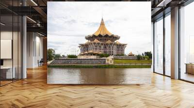 Kuching Malaysia Sep 3rd 2022: the view of Sarawak river and New Sarawak State Legislative Assembly Building. 
The cross-section of the building is designed like a nine-pointed star. Wall mural