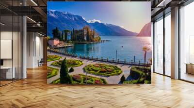 Beautiful and colorful autumn in Riva del Garda,Panorama of the gorgeous Garda lake surrounded by mountains in the autumn time Wall mural