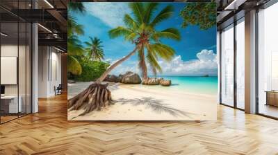 Palm tree bending over white sand beach with turquoise water. Wall mural