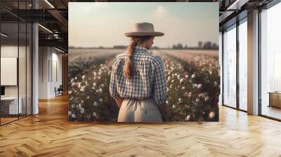 Female farmer wearing a hat and plaid shirt in a beautiful cotton field. Generative AI Wall mural