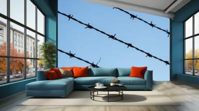 barbed wire against sky Wall mural