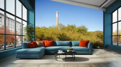 Horizontal wide view of restored Smokestack «La Ramona» built in 1890 in industrial mining ruin in El Triunfo, Baja California Sur, Mexico Wall mural