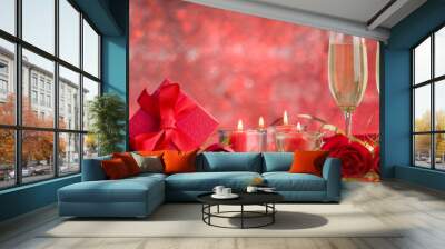 champagne glasses, roses and candles on red drape Wall mural