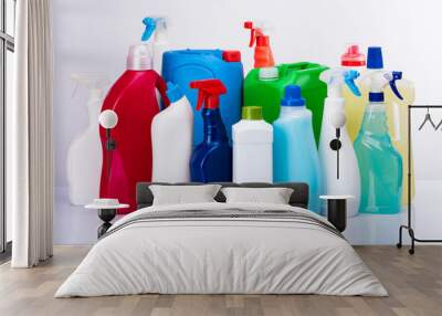 cleaning concept with various plastic bottles and canisters on white background Wall mural