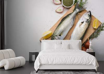 Raw fresh bluefish on cutting board. Background is white marble Wall mural