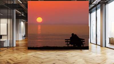 Silhouette of man and woman, Couples hugging, Sunset in autumn Wall mural