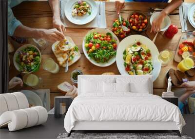 Family enjoying a meal made from organic food at a dining table Wall mural