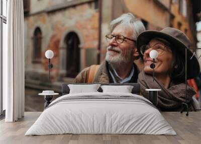 Retired couple exploring a historic city. Wall mural