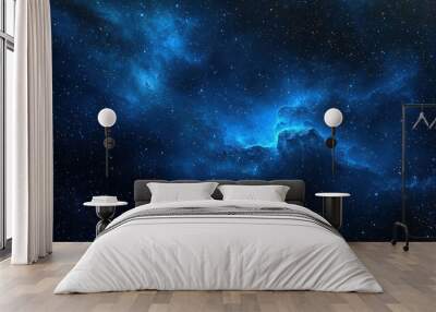 Blue Space Nebula. A deep space scene featuring a glowing blue nebula with stars scattered across the background. Wall mural