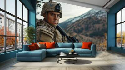 A male soldier in tactical gear holds a rifle in a rugged outdoor landscape, displaying focus and determination. Wall mural