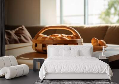 Basket with fresh bread on the table in the morning light Wall mural