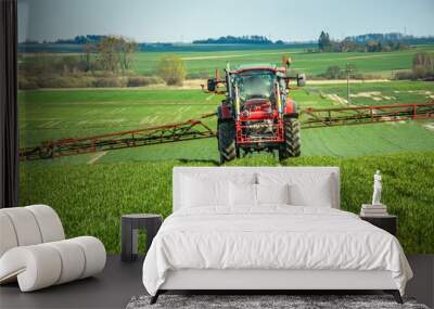 Tractor spraying the rural green field Wall mural