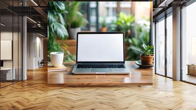 Laptop mockup with blank screen on table with green plant Wall mural