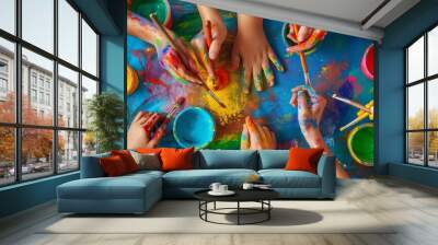 Children’s Hands Engaged in Creative Finger Painting and Brush Art Activities with Vibrant Colors on a Large Canvas Wall mural