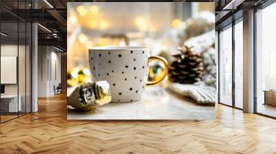 Cozy winter holiday decoration, Christmas lights and coffee cup with decor details, real home Wall mural