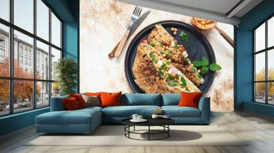 Healthy vegetarian tortilla or pita bread with chickpeas, vegetables and herbs served with homemade hummus in vintage dishes. Healthy eating concept. Light background. Top view. Copy space Wall mural