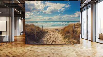 Sandy beach path  capturing picturesque ocean waves on a sunny day with fluffy clouds Wall mural