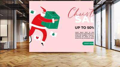 Santa claus with gift box comes out of smartphone. Fast online delivery Christmas gifts concept. Wall mural