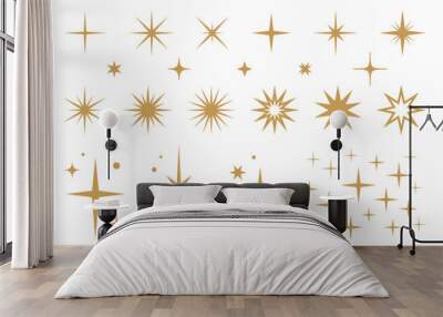 Gold futuristic sparkle icons collection. Set of stars shapes isolated on white background. Abstract gold shine effect sign vector design. Wall mural