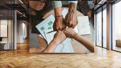 Top view of group multi ethnic coworkers stacked hands together as concept of corporate unity Wall mural