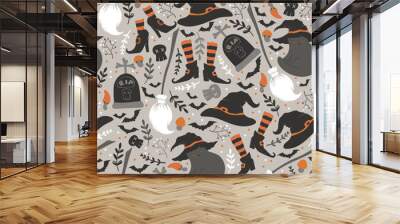 Happy Halloween vector seamless pattern with cute cats, witch hats and shoes, bats and skulls isolated on grey background. Illustration for poster, greeting card, fabric print, invitation Wall mural