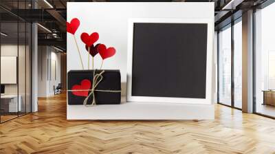 Empty blank frame with black paper and decorative heart love affection Valentine day elements. Wall mural