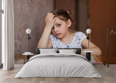 First-grader doing homework at home Wall mural