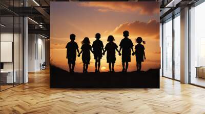 Group of children holding hands and walking into the sunset. Wall mural