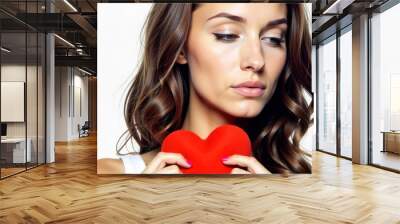 Portrait of a beautiful girl with a red heart on a white background Wall mural