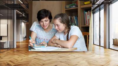 Teen girl with   tutor   learning   lessons. Wall mural