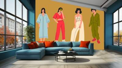 Set of young women dressed in stylish trendy clothes. Fashion look. Female models standing in various poses. Different clothing. Cartoon style. Fashionable ladies. Hand drawn Vector illustration Wall mural