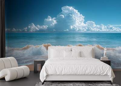 Dynamic photograph of a beach with gentle waves and clear skies, contrasted with dark storm clouds on the horizon, reflecting the vulnerability of coastal areas to climate change. high resolution Wall mural