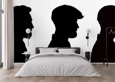 Three profile silhouettes of handsome bearded man wearing flat cap and peaked cap.   Wall mural