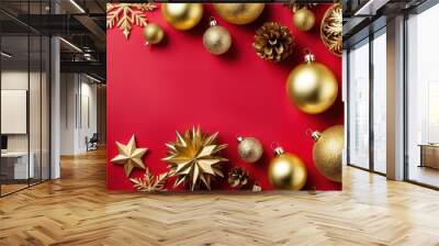 A festive arrangement of golden ornaments and pinecones on a red background for holiday decor. Wall mural