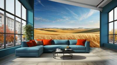 Expansive golden wheat fields under a bright blue sky with wispy clouds. Wall mural