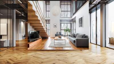 Spacious living room with wooden stairs Wall mural