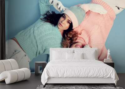 beautiful young girls wear cozy warm knitted clothes Wall mural