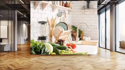 Close up of table with green vegetables in the kitchen Wall mural