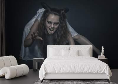 Terrible screaming ghost with horns on dark Wall mural