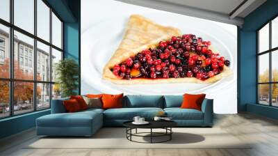 Thin delicious pancake with berries on white Wall mural