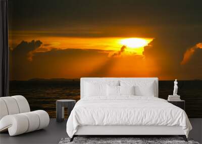 sunrise on silhouette cloud sky fishing boat and on sea island Wall mural