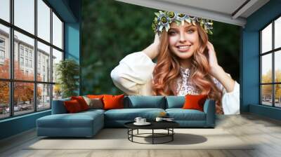 Beautiful woman in flower wreath and beautiful dress outdoor. 
 Wall mural