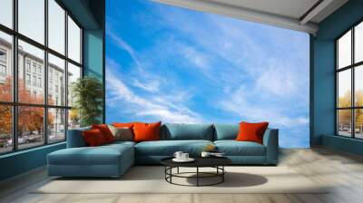 Blue sky background with tiny clouds Wall mural