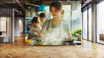 Dedicated young Asian wife cooking a wholesome meal for her children in the comfort of her home, embodying family values and care Wall mural