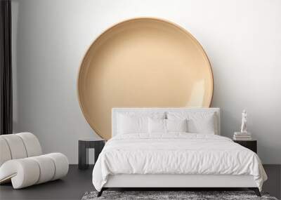 Empty beige plate on white background. Wall mural