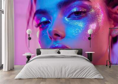 Fashion model in bright neon makeup poses in studio. Wall mural